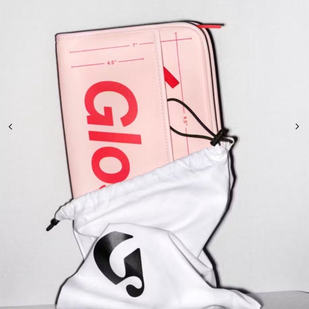 Brand new.  Never been used. Glossier large makeup bag with divider and dustbag